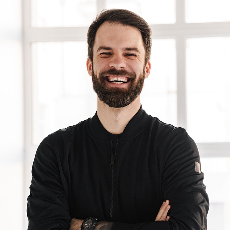 Smiling young brunette white man in sportswear 1 1.jpg