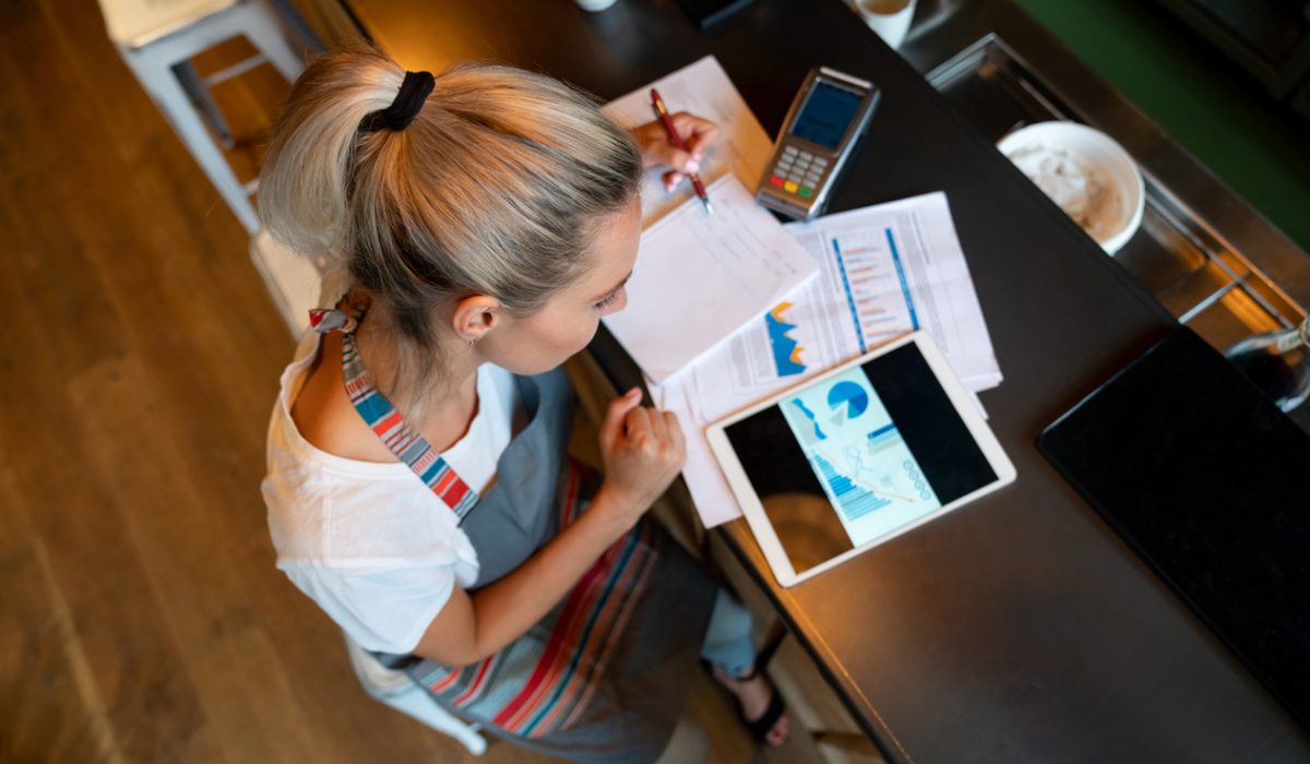 Business manager doing the books at a bar